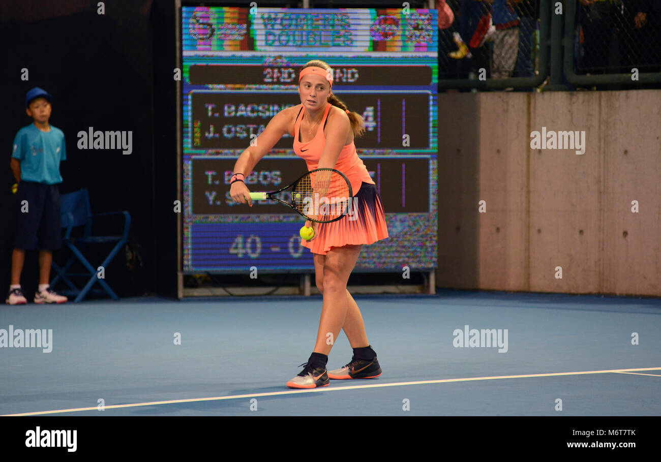 Latvia's Jelena Ostapenko prepares to serve in the women's doubles at the China Open tennis tournament in Beijing, October 2016 Stock Photo