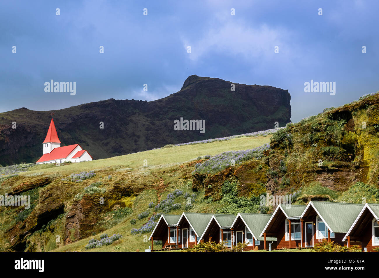 Red Roof Church On The Hill With Summer Cottages In The