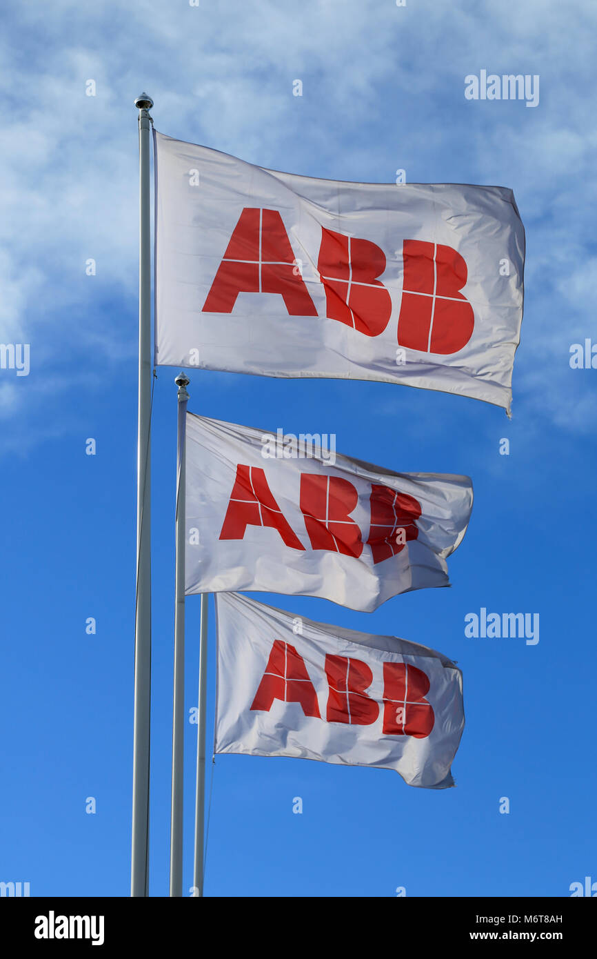 TURKU, FINLAND - MARCH 8, 2014: ABB flags against blue sky. The ABB board of Directors will propose Finnish Matti Alahuhta as a new board member at th Stock Photo