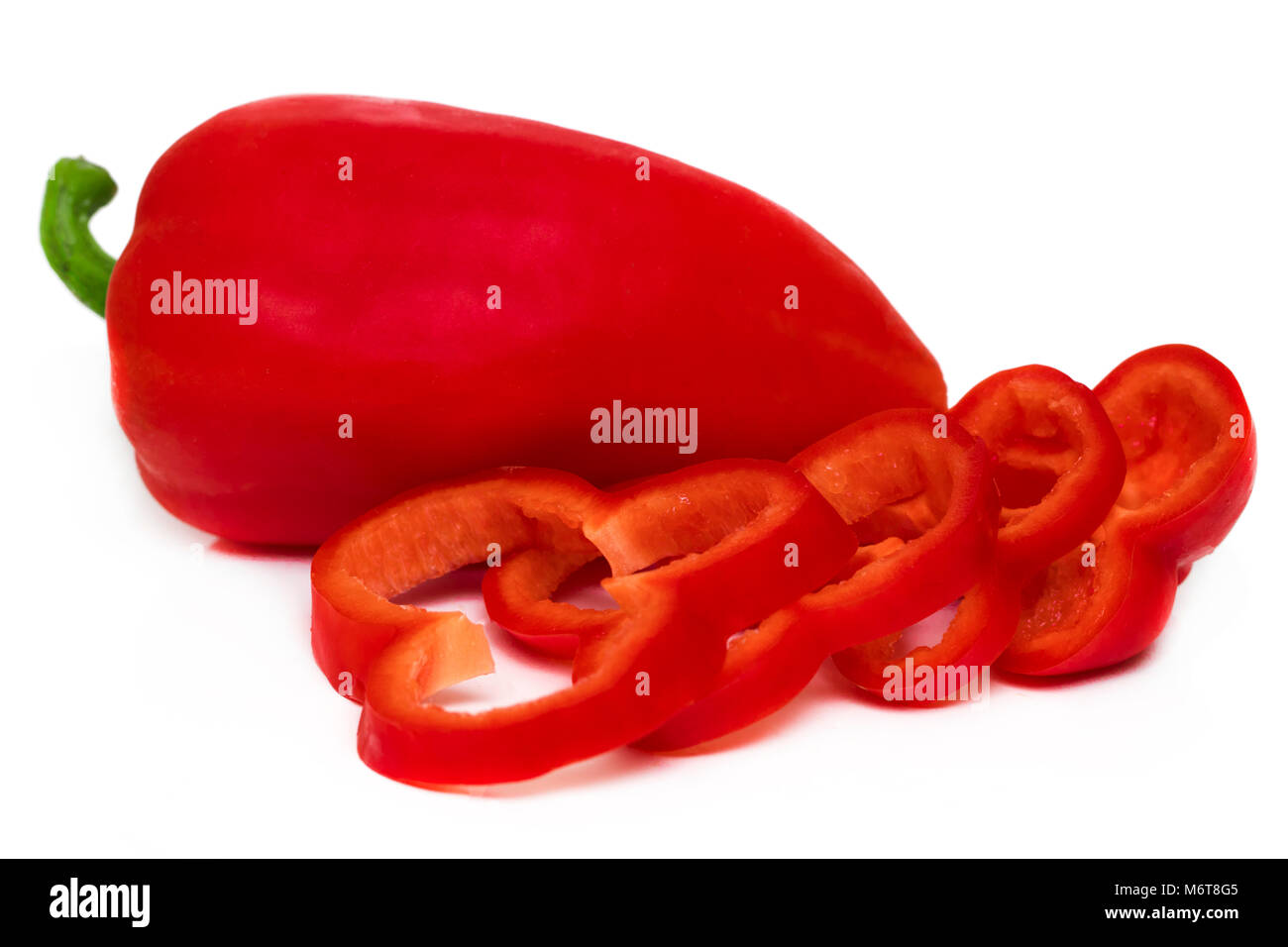 Red sweet bell pepper slices isolated on white background Stock Photo ...