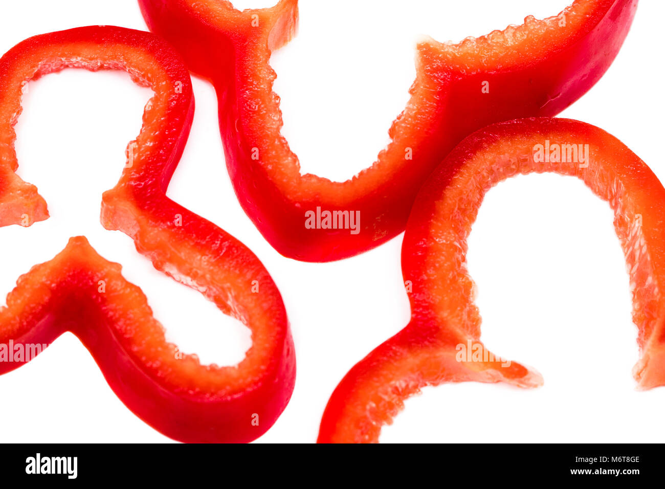 Red sweet bell pepper slices isolated on white background Stock Photo ...