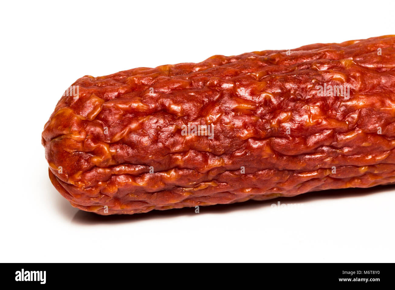 Salami smoked sausage isolated on white background. Stock Photo