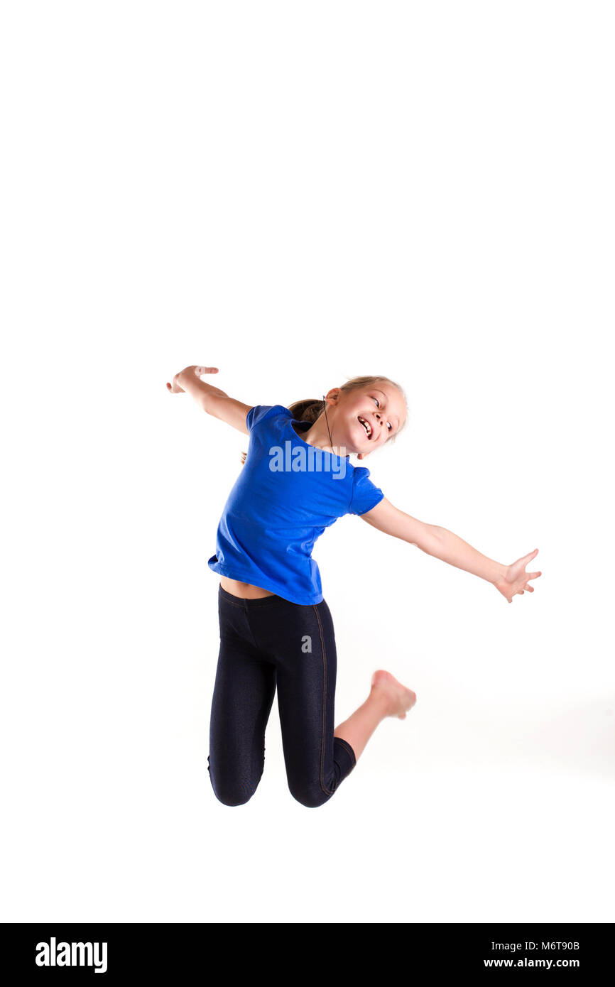 Active happy little girl jumping isolated on white Stock Photo