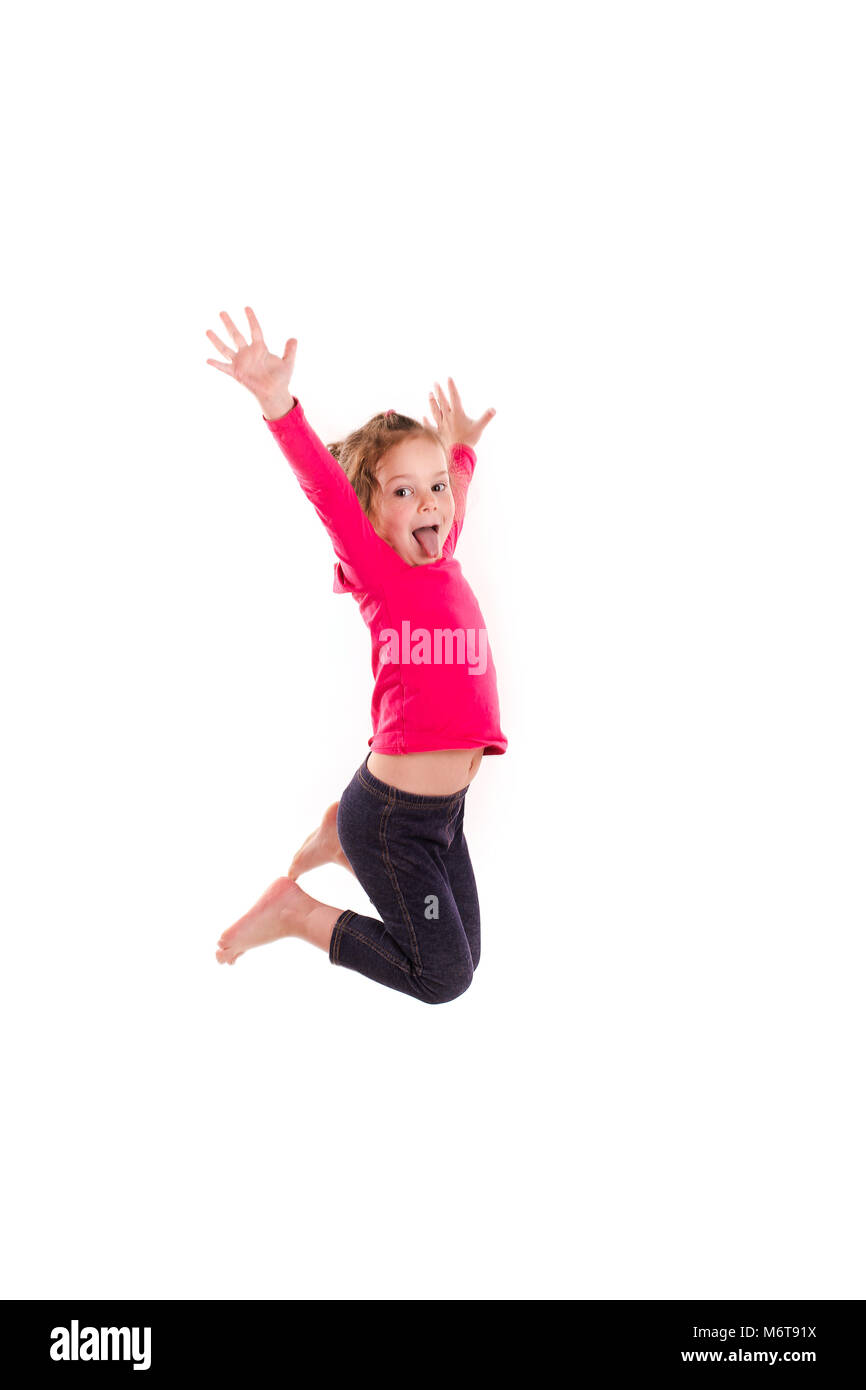 Active happy little girl jumping isolated on white Stock Photo