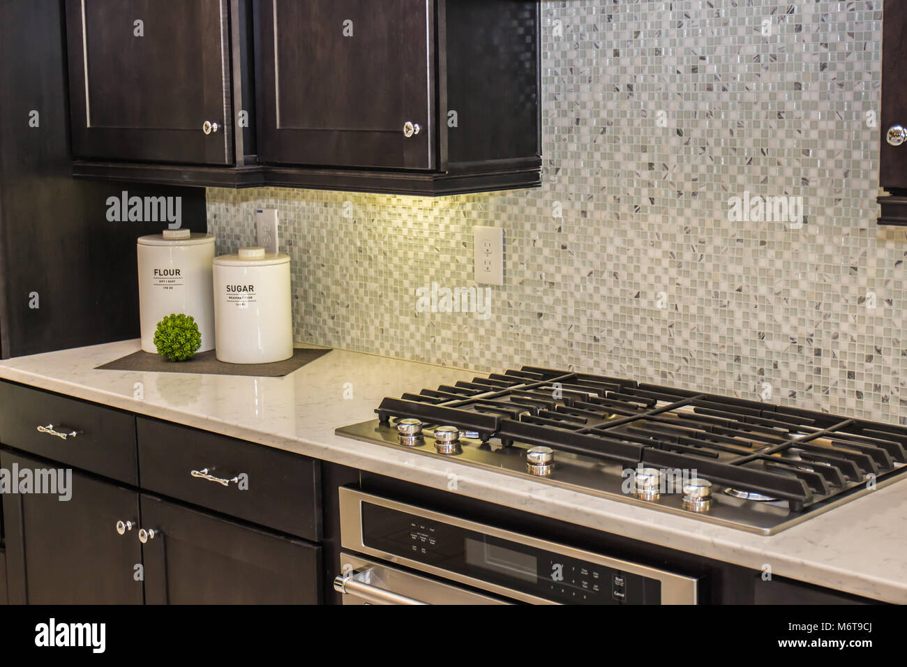 Modern Kitchen Counter With Canisters Stove Top Stock Photo