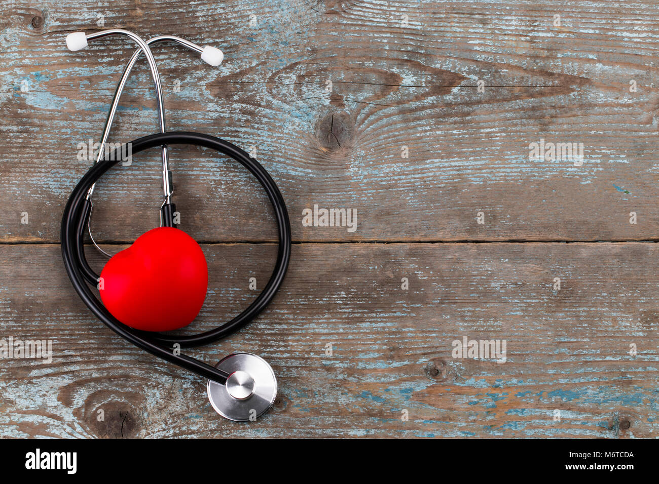Stethoscope with red heart on a wood background.with copy space Stock ...