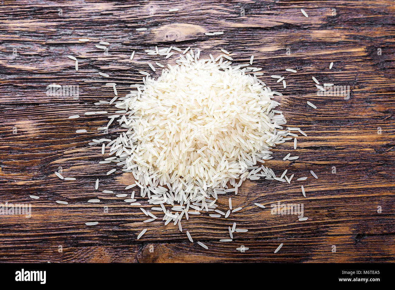 raw rice scattered on the rough surface, top view Stock Photo Alamy