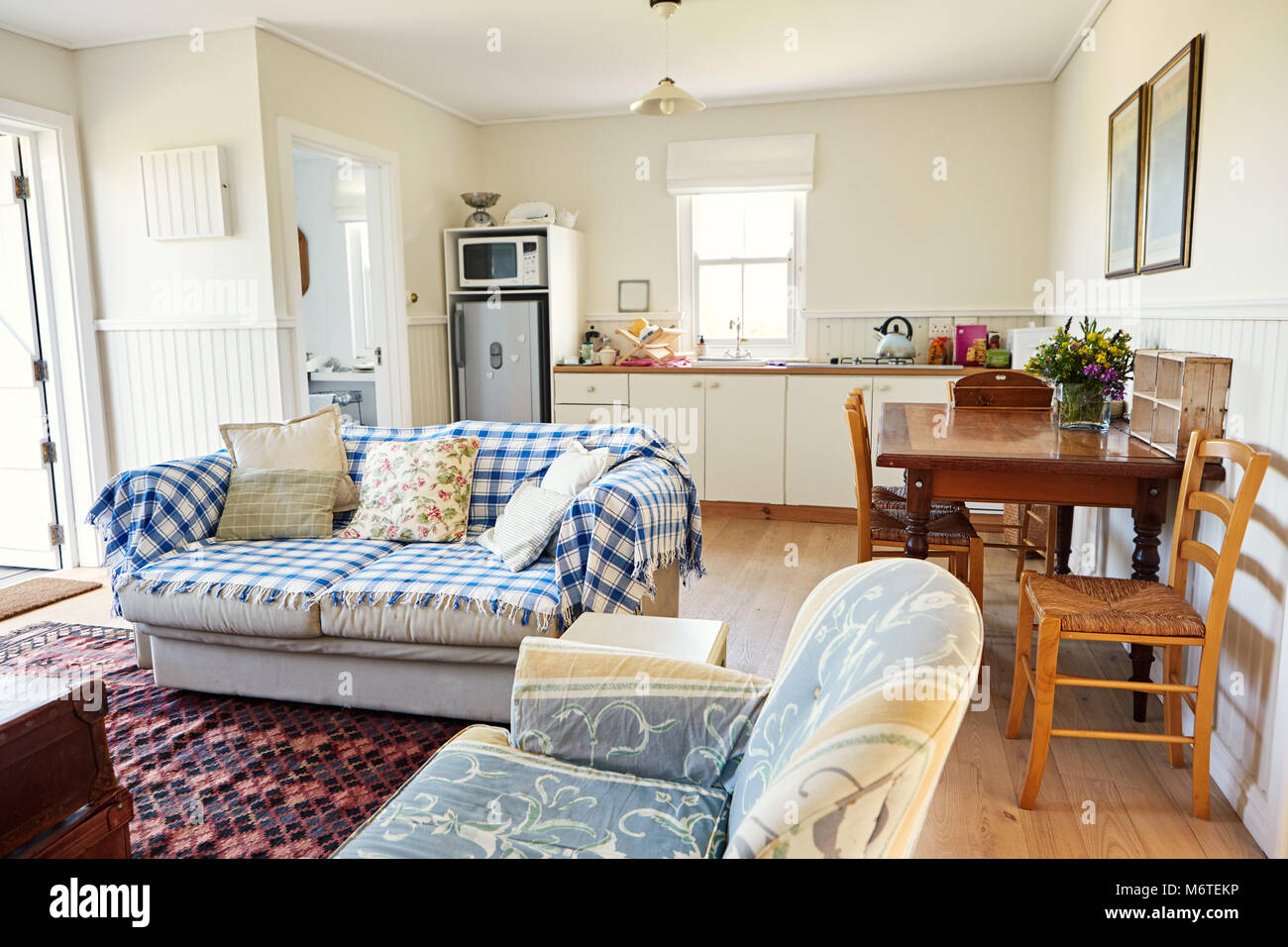 Lounge and kitchen in a small country home Stock Photo