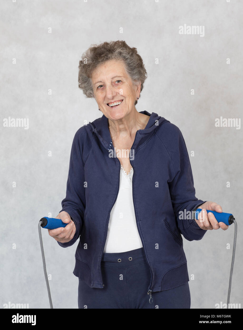 Senior woman jumping rope hi-res stock photography and images - Alamy