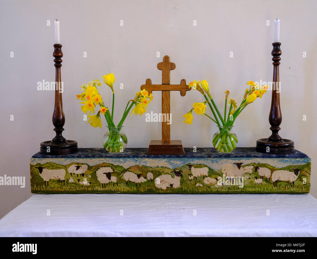 Spring altar decoration in St Andrew's chapel - known as the 'Shepherd's Church' - near Didling, West Sussex, UK Stock Photo