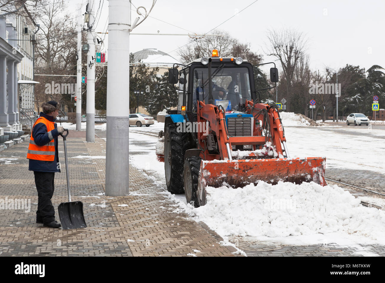Evpatoria, Crimea, Russia - February 28, 2018: Snow-removing works on the Theater Square in Evpatoria, Crimea Stock Photo