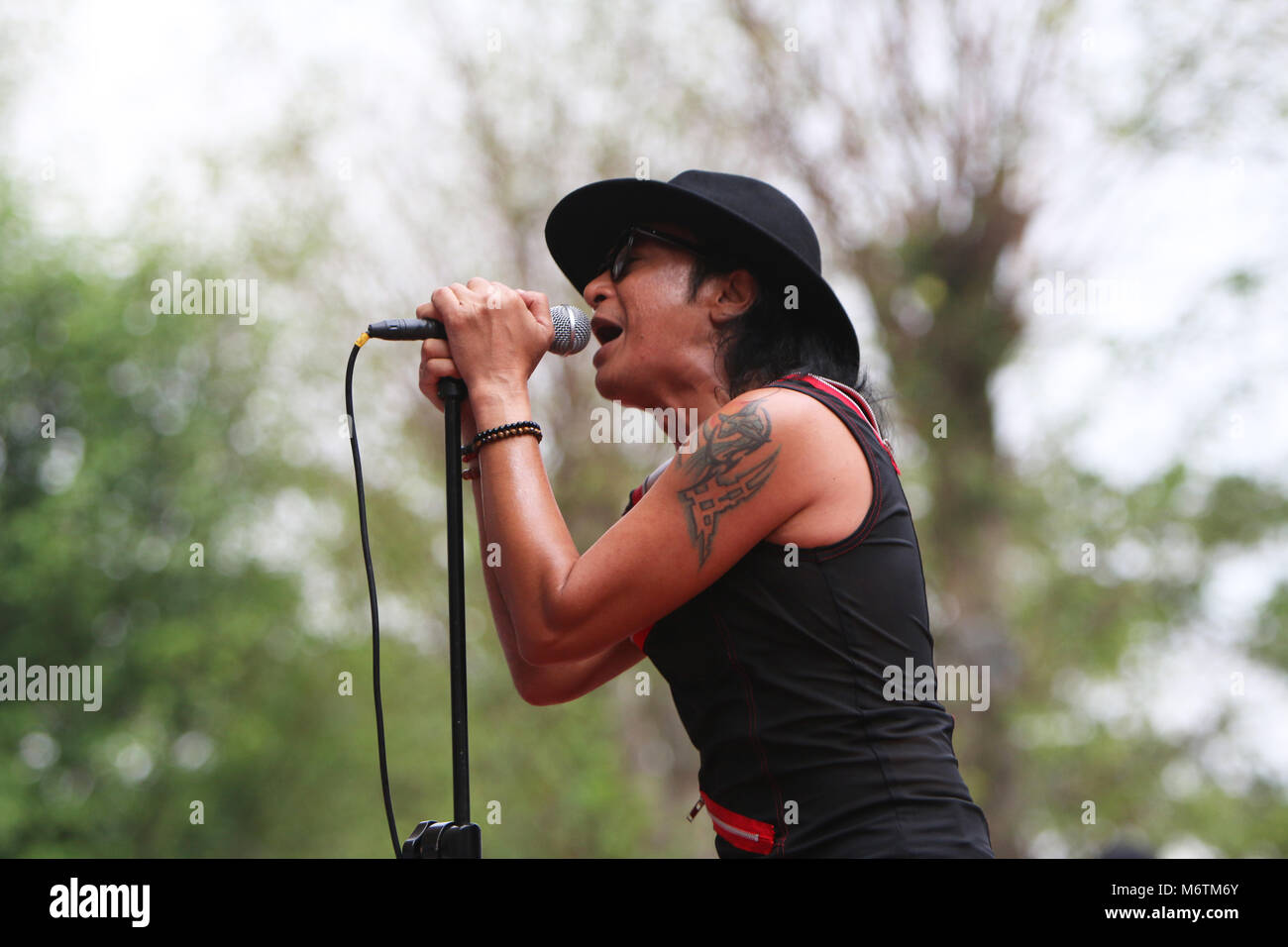 Bogor, Indonesia. 22nd July, 2017. Indonesia rock star, Andy /RIF vocalist  of the famous rock band in Indonesia /RIF band perform in the Bogor tourist  park, Indonesia, entertaining the audience with the