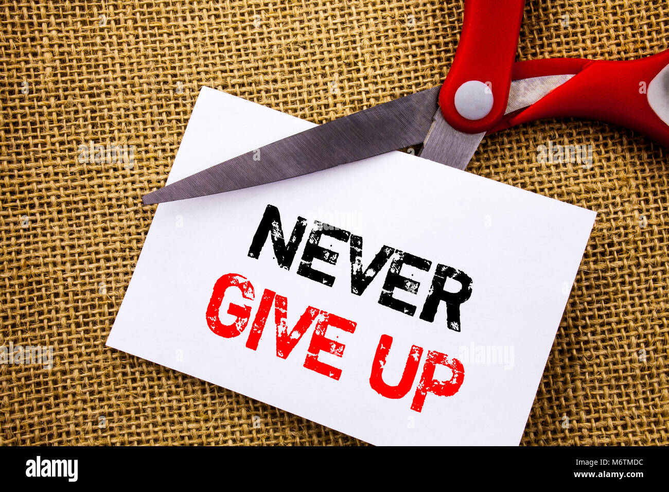 Handwriting text showing Never Give Up. Conceptual photo Motivation Quote For Success Achievement Challenge written Sticky Note Paper Cutting by Sciss Stock Photo