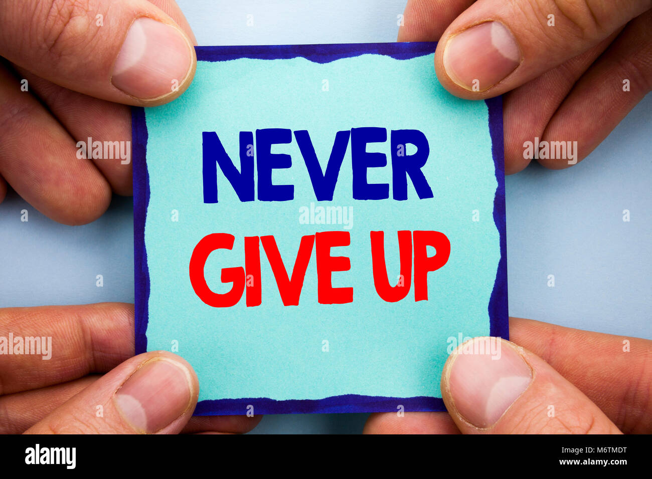 Handwriting Announcement text showing Never Give Up. Business photo showcasing Motivation Quote For Success Achievement Challenge written Sticky Note  Stock Photo