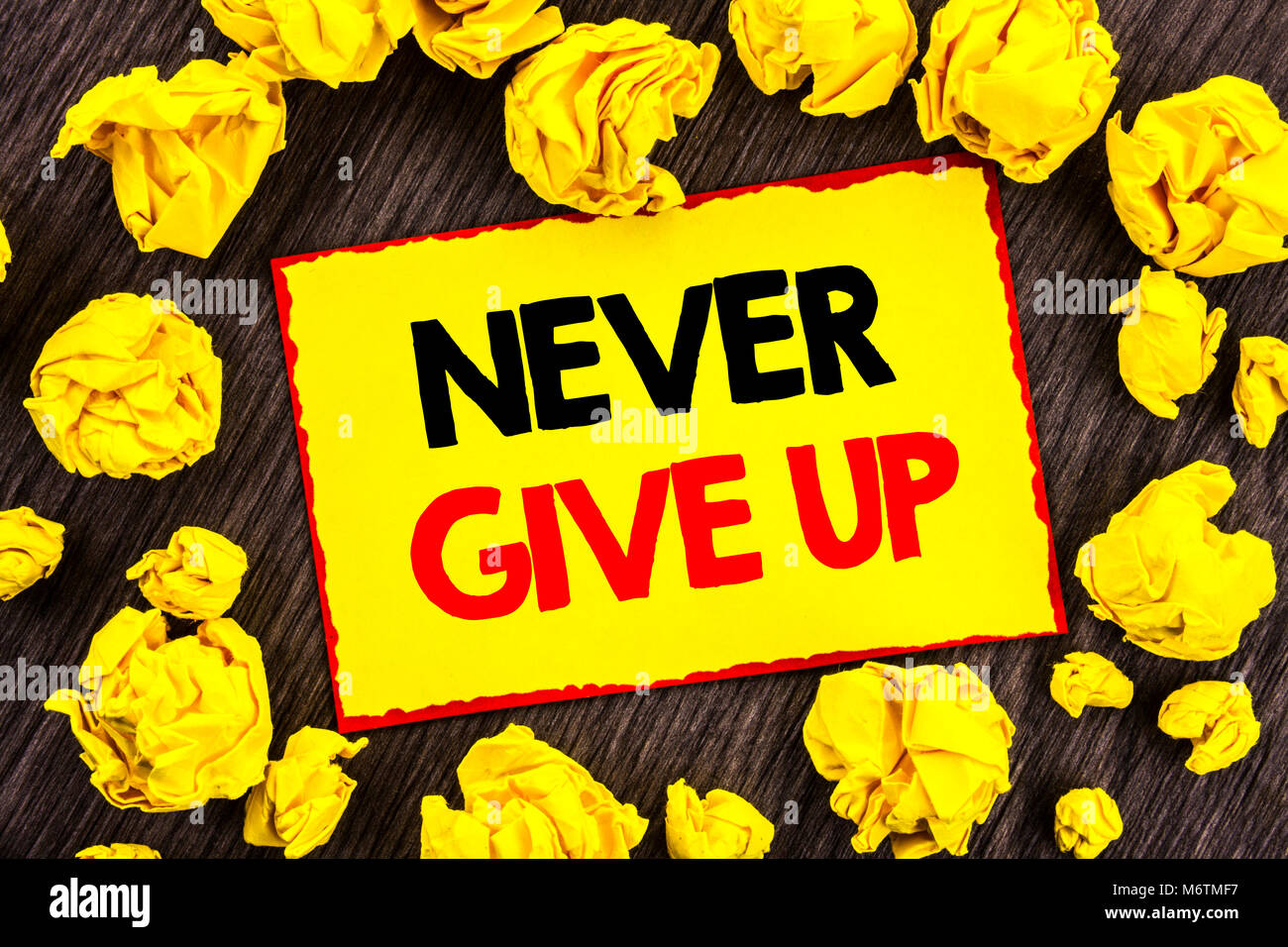 Handwriting Announcement text  Never Give Up. Conceptual photo Motivation Quote For Success Achievement Challenge written Yellow Stikcy Note Folded Pa Stock Photo