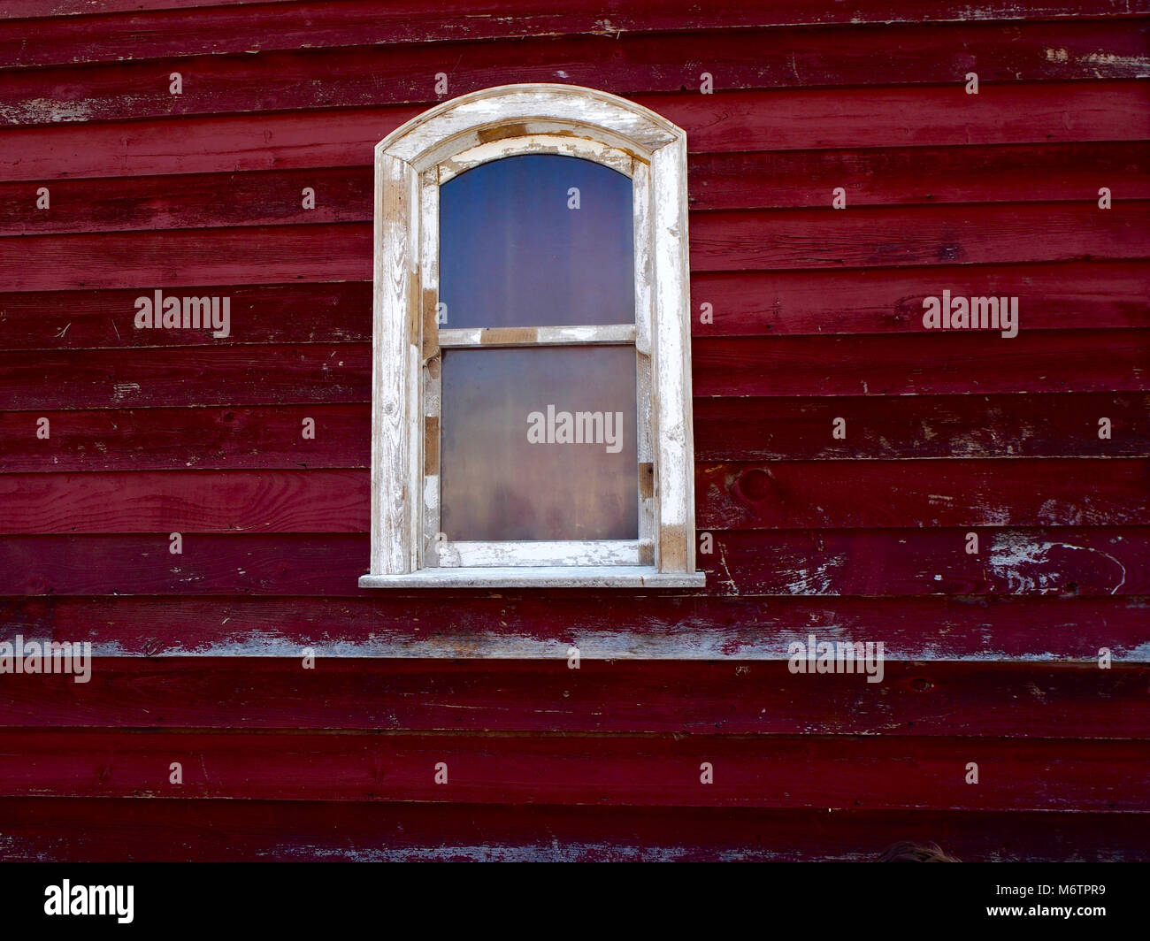 White window on red wood wall Stock Photo - Alamy