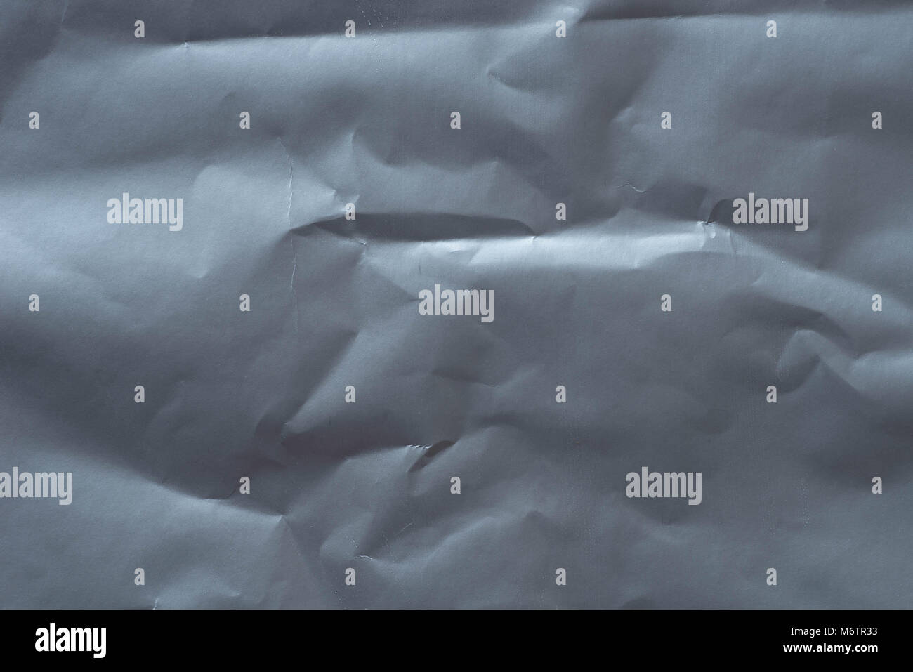 creased silver paper background texture closeup Stock Photo - Alamy