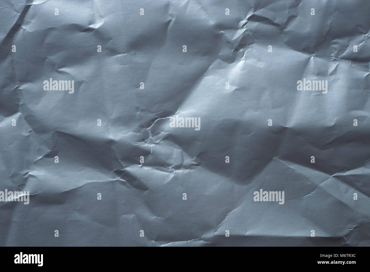 creased silver paper background texture closeup Stock Photo - Alamy