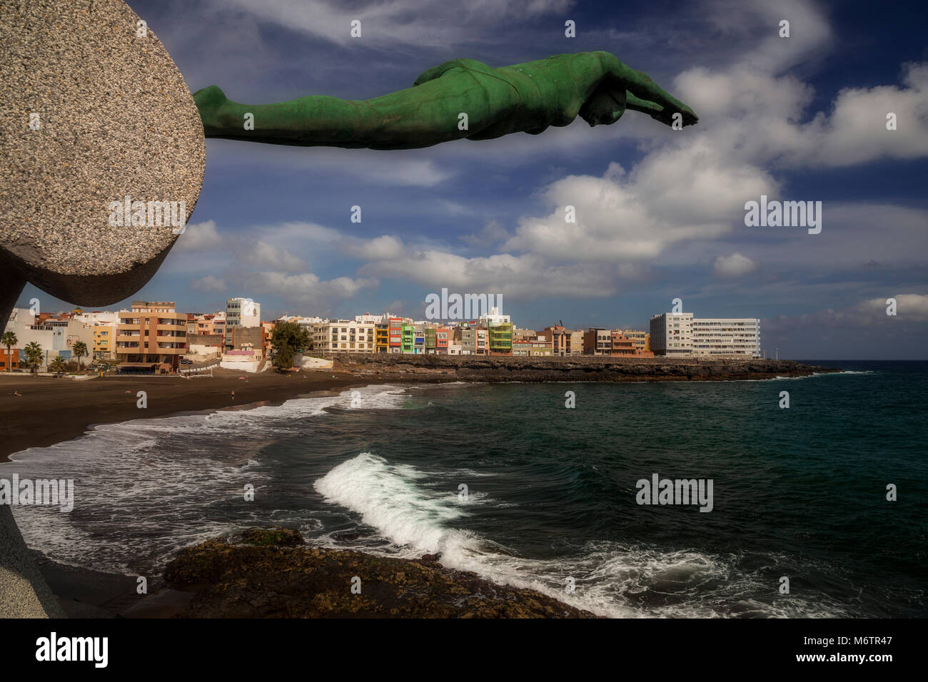 Bronze sculpture of a woman diving on the Atlantic coast at La Garita, Gran Canaria Stock Photo