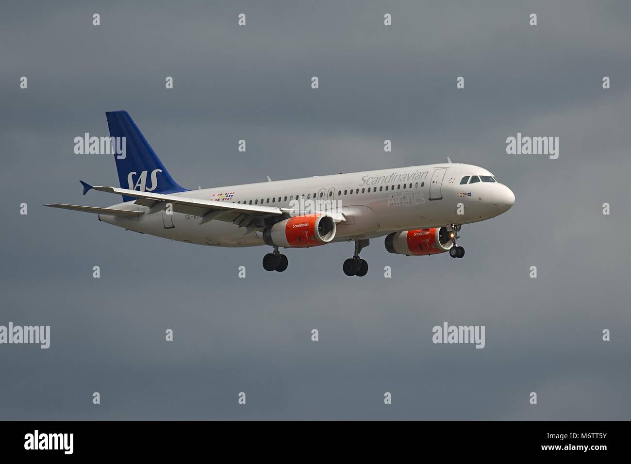 Passenger Plane Landing Stock Photo