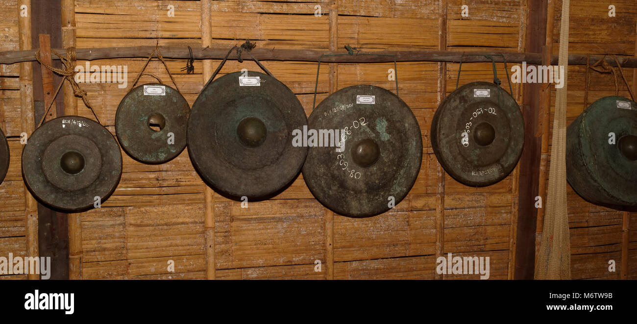 Row of Bidayuh gongs in the Sarawak Cultural village, Kuching, Malaysia Stock Photo