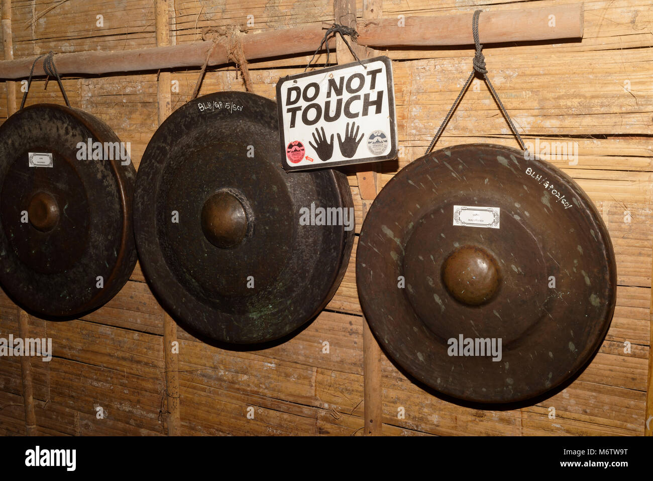 Row of Bidayuh gongs in the Sarawak Cultural village, Kuching, Malaysia Stock Photo