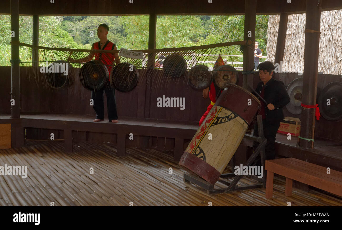 Row of Bidayuh gongs in the Sarawak Cultural village, Kuching, Malaysia Stock Photo