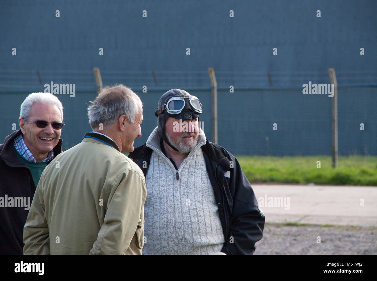 Man wearing an aviator helmet and goggles at Bugatti club meeting Stock Photo