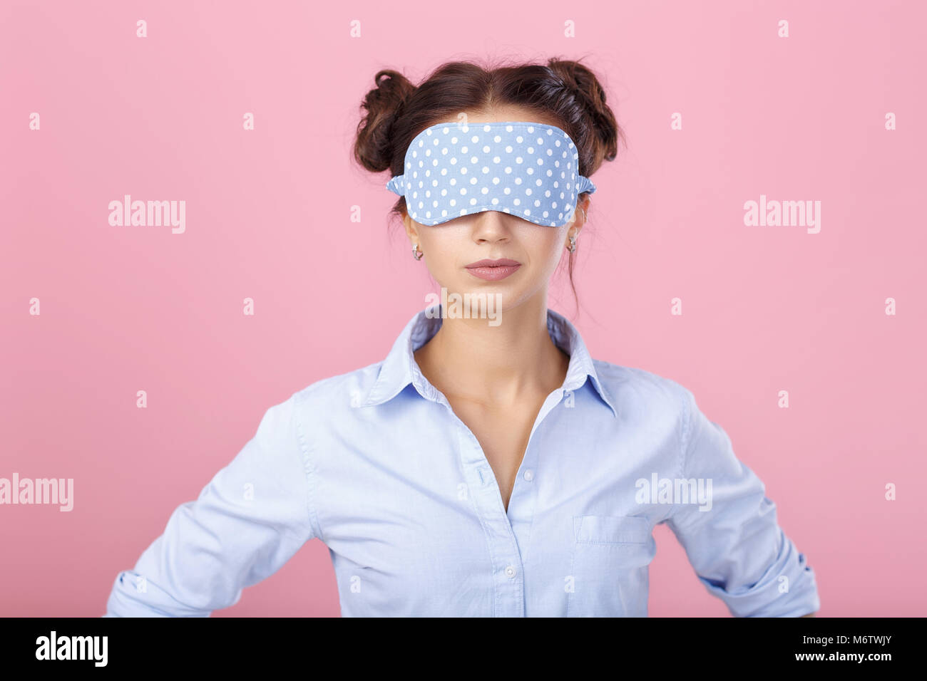 A Young Girl, in a Bra and a Sleeping Mask, Holds a Bottle of Alcohol and  Looks at it. on a Red Background. Stock Photo - Image of excitement,  breast: 106671990