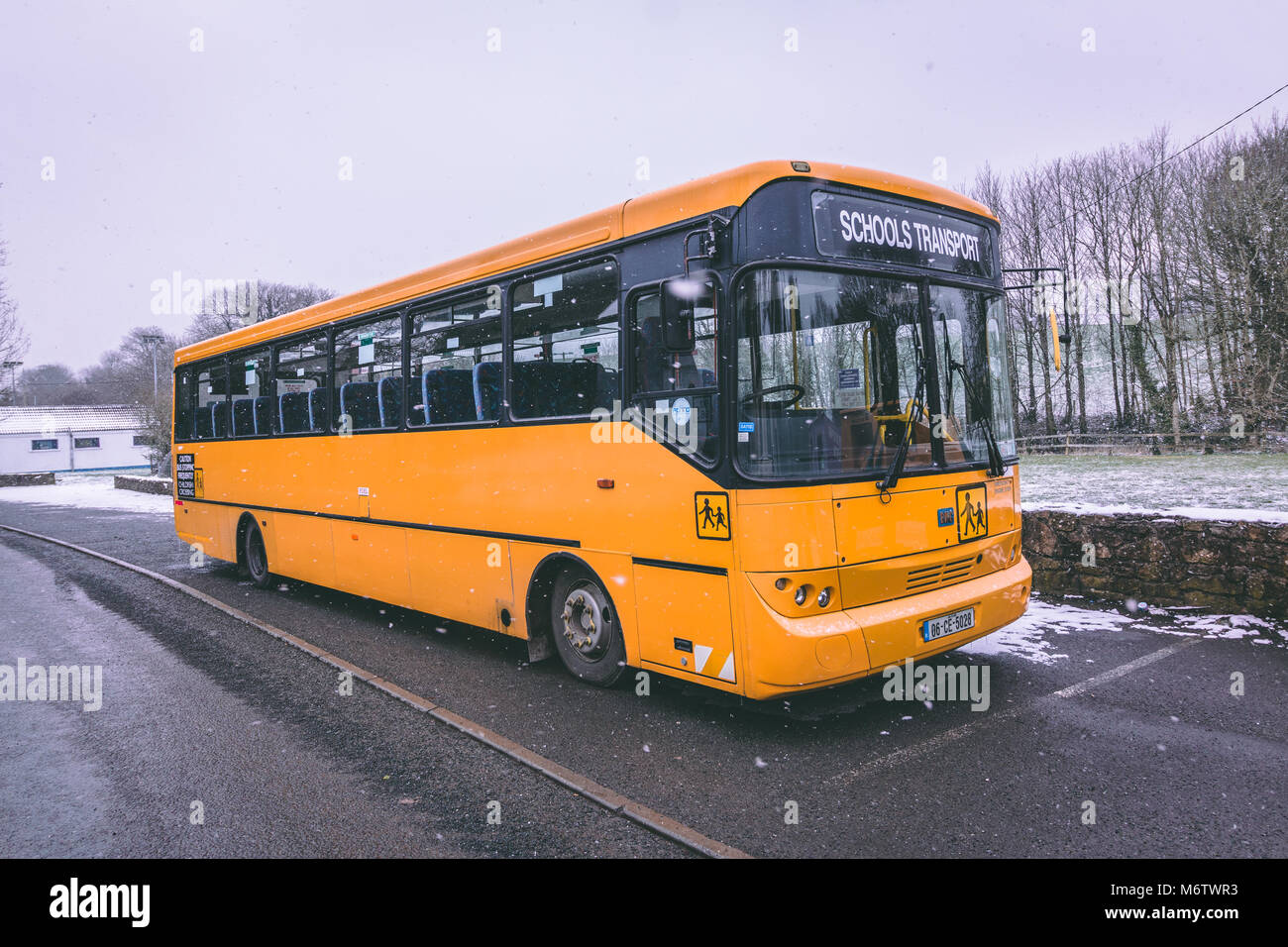 March 1st, 2018, Carrignavar, county Cork, Ireland - school bus parked during Storm Emma, also known as the Beast from the East. Stock Photo