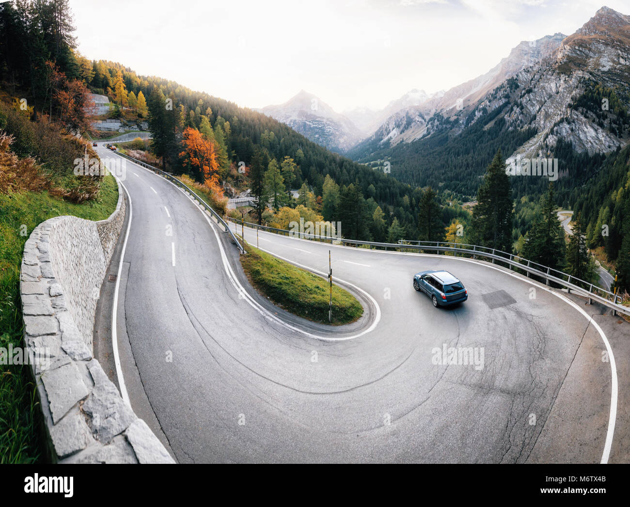 Adventure trip by car along winding mountain alpine road, Maloja Pass, Switzerland Stock Photo