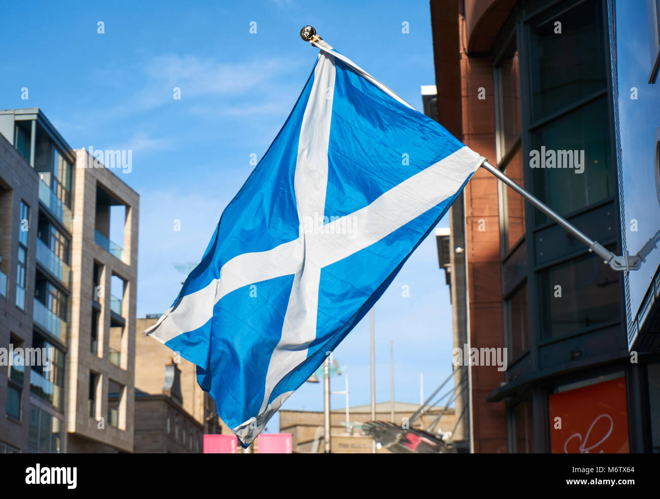 a large flag of Scotland displayed on the streets of Glasgow, UK. Stock Photo