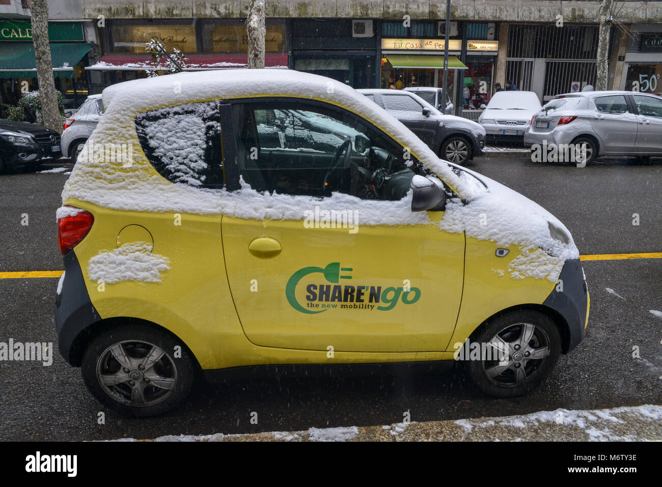Share 'n Go car on a street in Milan, Lombardy, Italy as part of the sharing economy Stock Photo