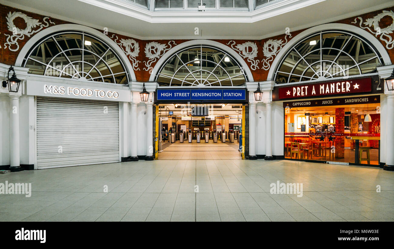 Entrance to ticket hall of High Street Kensington underground station with food options for commuters Stock Photo