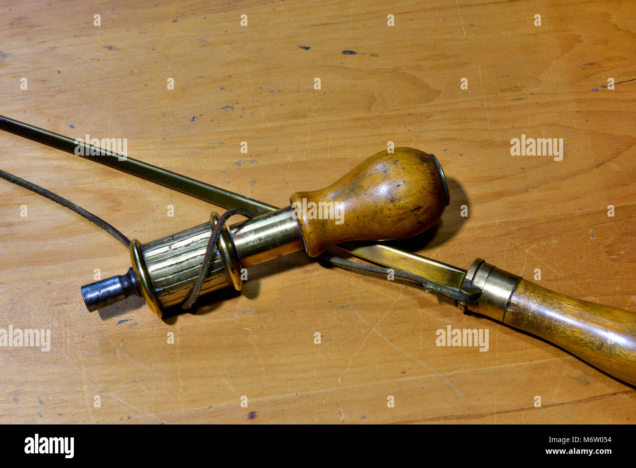 Close up of drill stock with leather thong from bow around it on hand operated bow drill Stock Photo