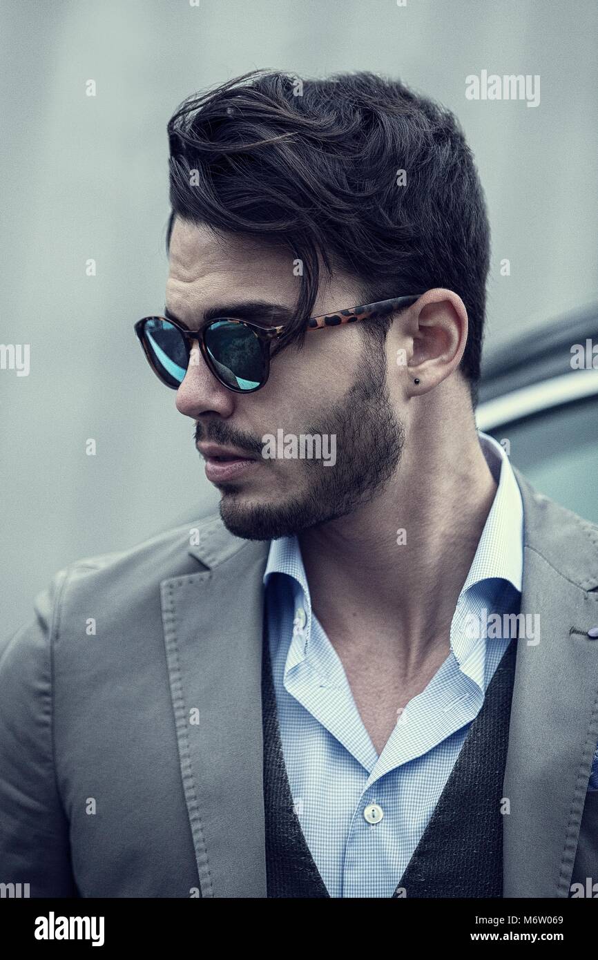Men with style (suit and shirt) who wear sunglasses, nice shoes and has  great hair Stock Photo - Alamy