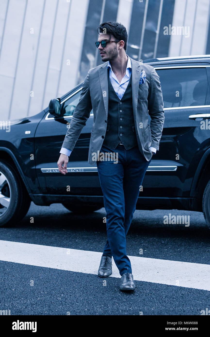 Men in suit with his luxury 4x4 Stock Photo Alamy