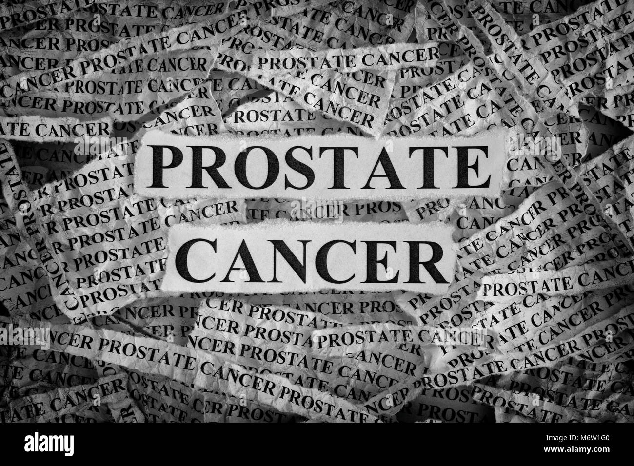 Prostate Cancer. Torn pieces of paper with words Prostate Cancer. Concept Image. Black and White. Closeup. Stock Photo