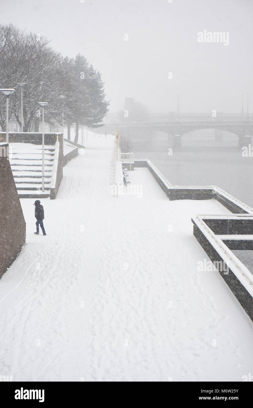 A view from South Portland Street suspension bridge over the river Clyde covered in snow following the 'beast from the east' storm, Glasgow, Scotland. Stock Photo
