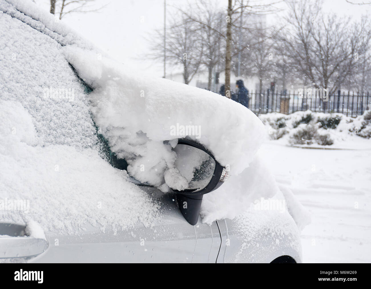 Parked car covere in thick snow following a heavy overnight snowfall due to 'the best from the east' cold front, Glasgow, scotland, UK Stock Photo