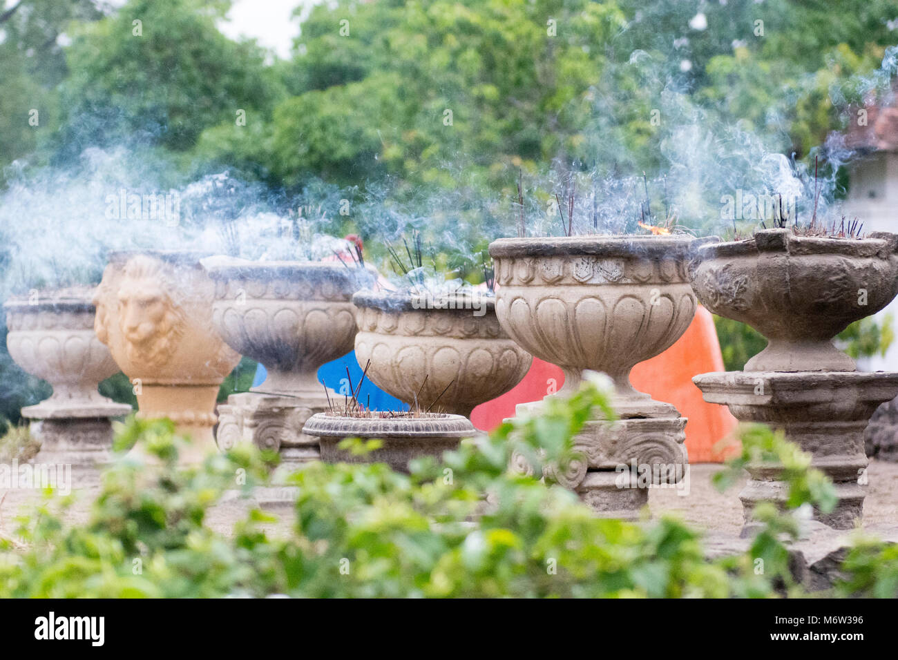 Incense sticks in the smoke hi-res stock photography and images - Alamy