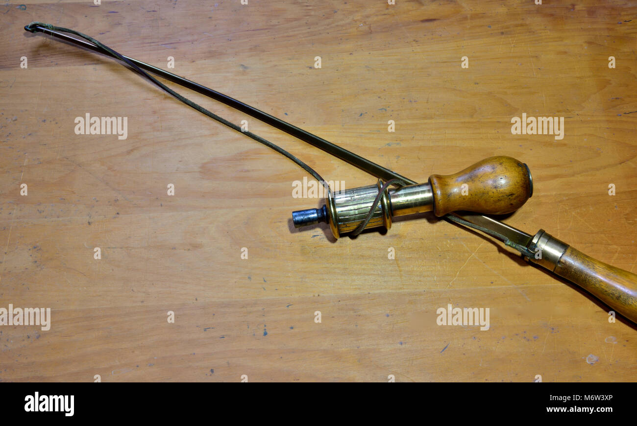 Hand operated vintage bow drill for drilling holes. Type of tool almost as old a man made fire, this one probably late 19th or early 20th century Stock Photo