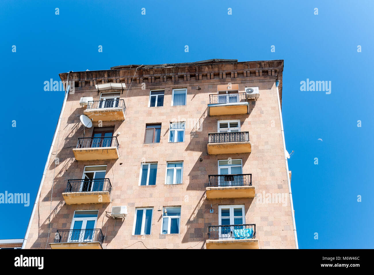 Rose apartment block on blue sky Stock Photo