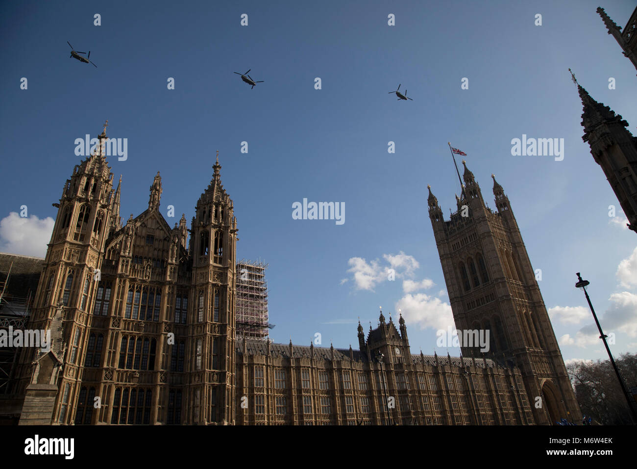 Chinook helicopters fly over the Houses of Parliament in London, England, United Kingdom. Part of a network of routes, known as the heli-lanes through London where helicopters can fly visually without needing to satisfy the equipment requirements of Class A Airspace. Stock Photo