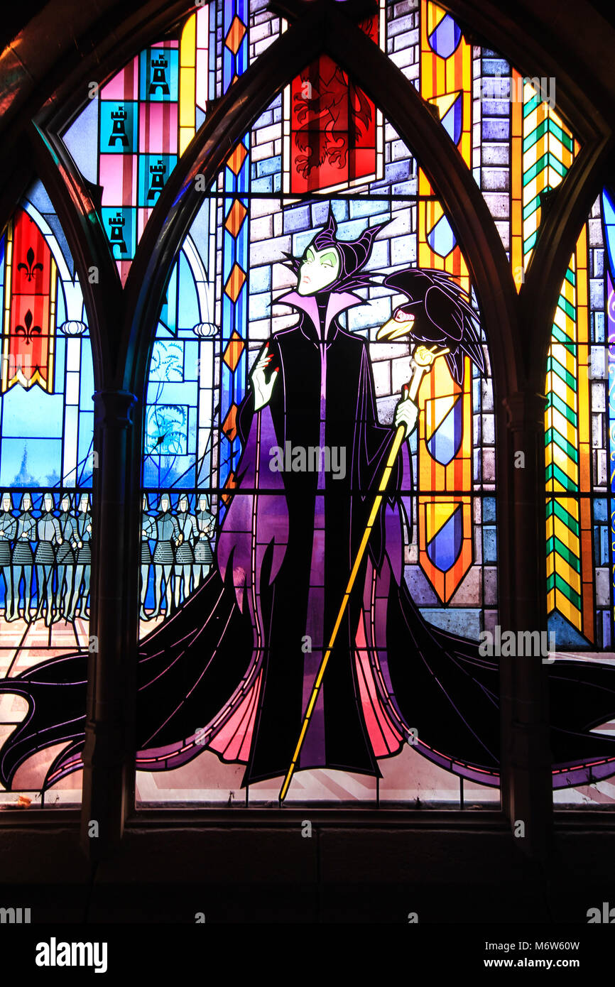 A stained glass window inside The Sleeping Beauty Castle at Disneyland of Maleficent The Wicked Queen from the Sleeping beauty animated Disney movie. Stock Photo