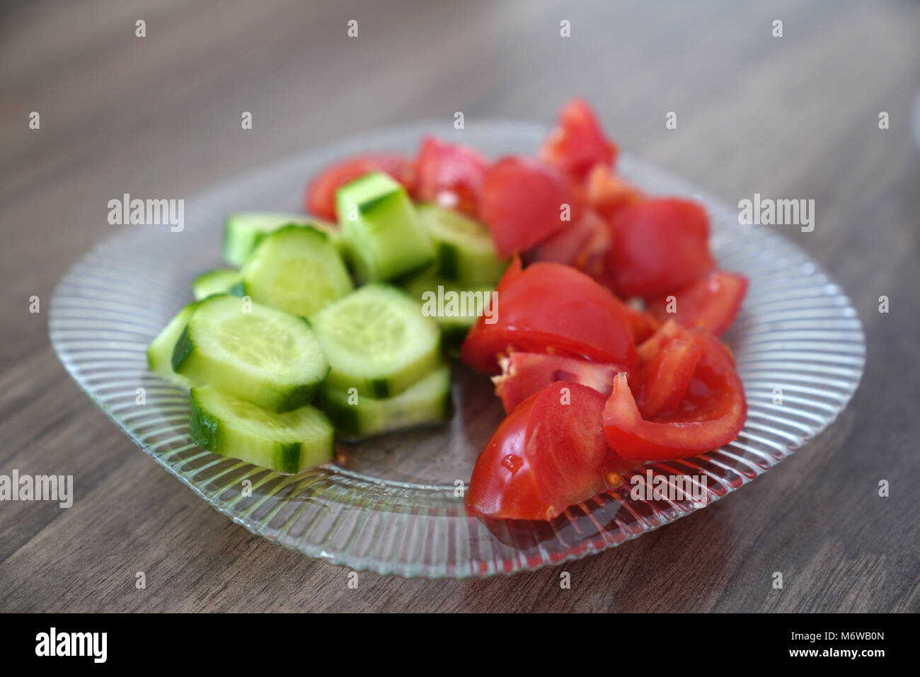 Sliced tomato and cucumber in a bowl Stock Photo - Alamy