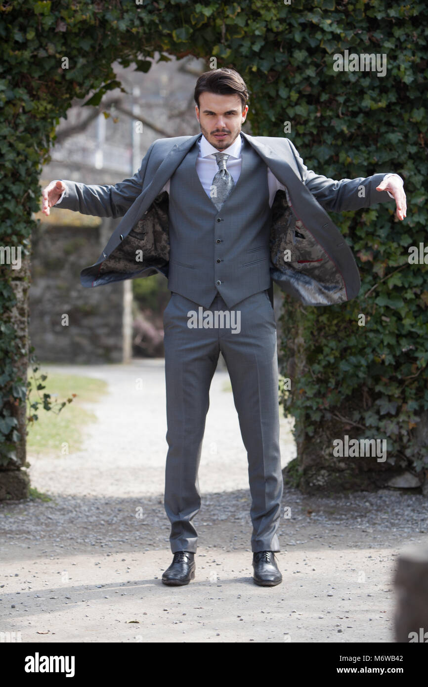Man with style who wears casual or suit and tie (costume for wedding) with  handcuffs Stock Photo - Alamy