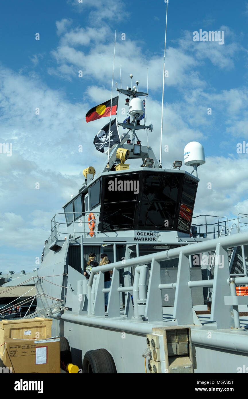 Bridge of Sea Shepherd's custom-built, high speed patrol ship, the 'Ocean Warrior', flying both the Sea Shepherd and the Australian Aboriginal flag Stock Photo