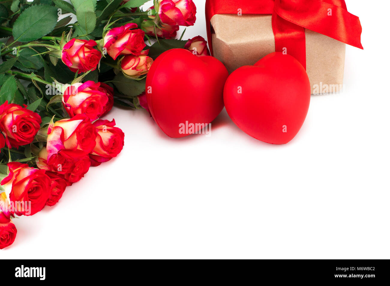 Red roses and Valentine's day hearts and gift on white background. With ...