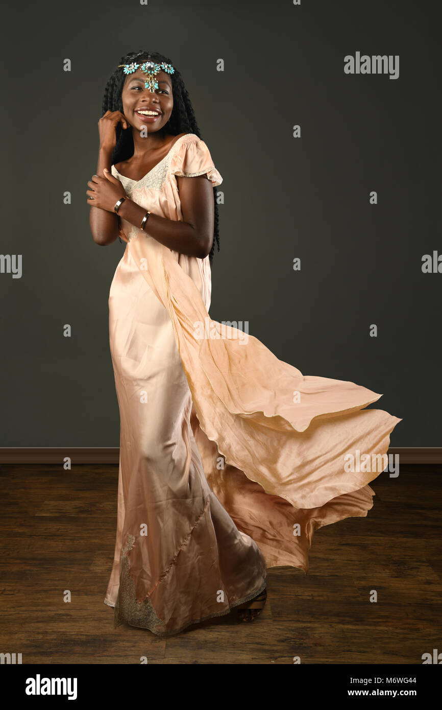 African American woman dressed in evening gown Stock Photo